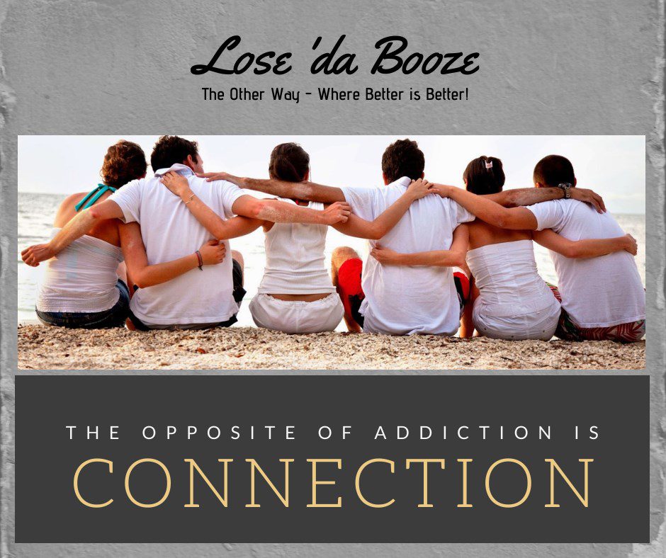 Group hugging sitting on a beach with text 